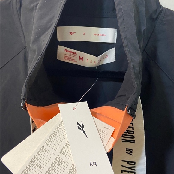 Reebok Pyer Moss Black Orange and White Windbreaker Jacket.New With Tags. Size-M - Picture 13 of 14